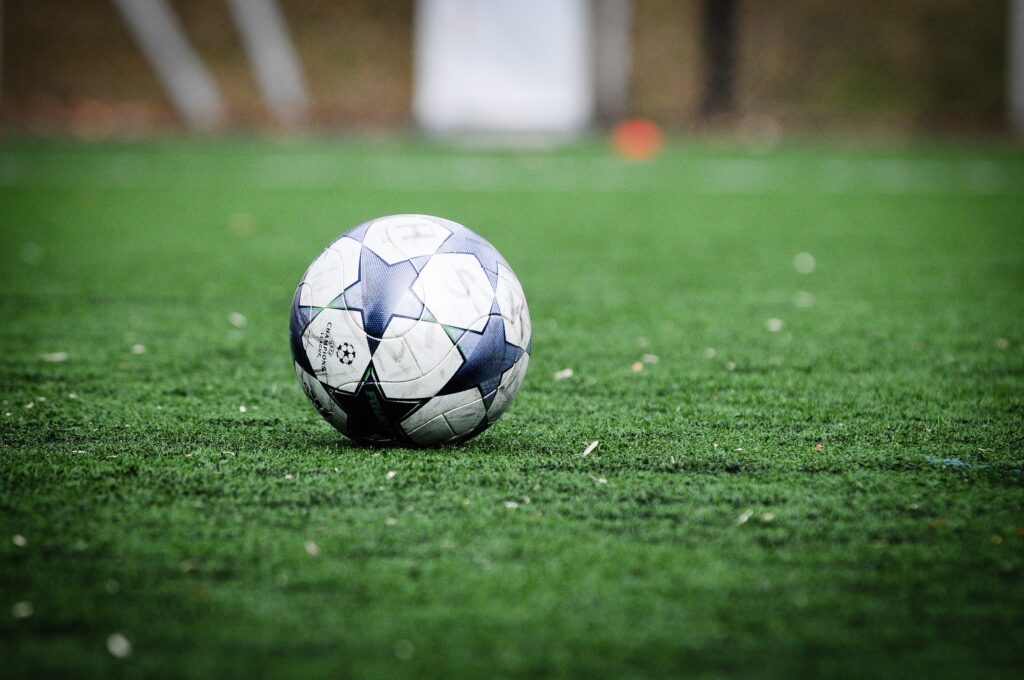 A football kept on the field during a training session. Pep Guardiola 5 strategies for success.